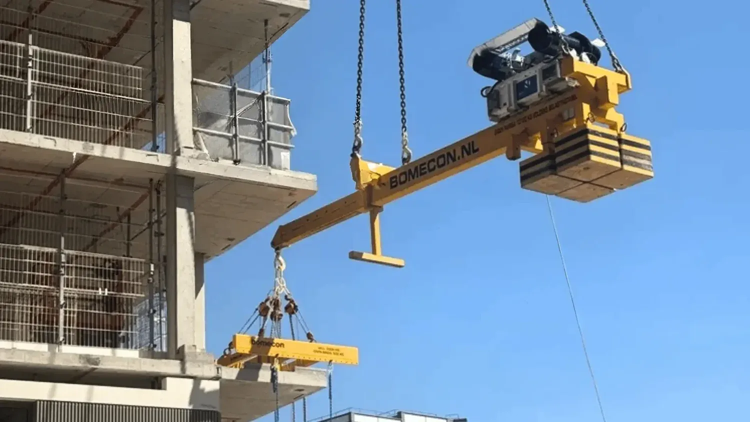 RocketLever positioning a precast panel beneath a building overhang